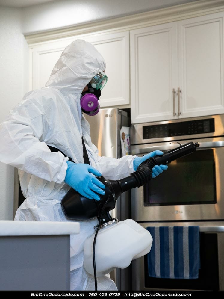 Bio-One Oceanside - Technician disinfecting kitchen odor