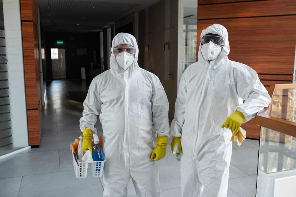 deep cleaning crew in hazmat suit